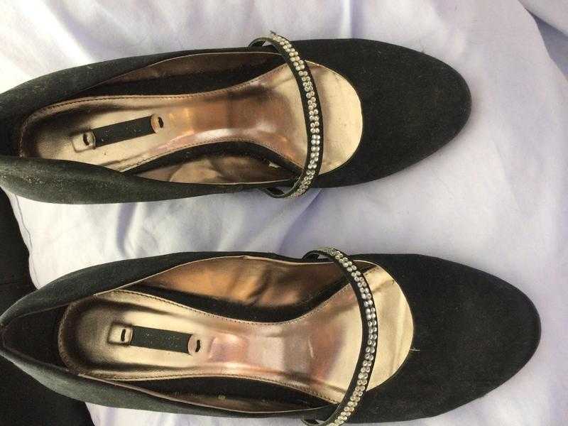 10 size 7 black  shoes , with glitter strap .