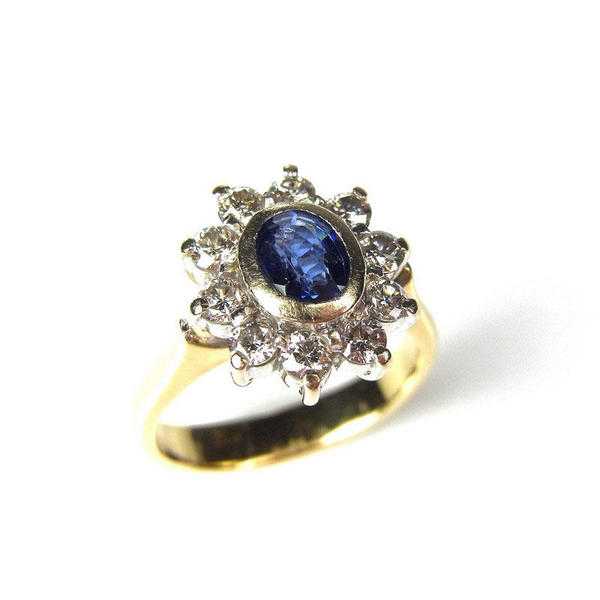 18 ct yellow gold sapphire and diamond flower ring.