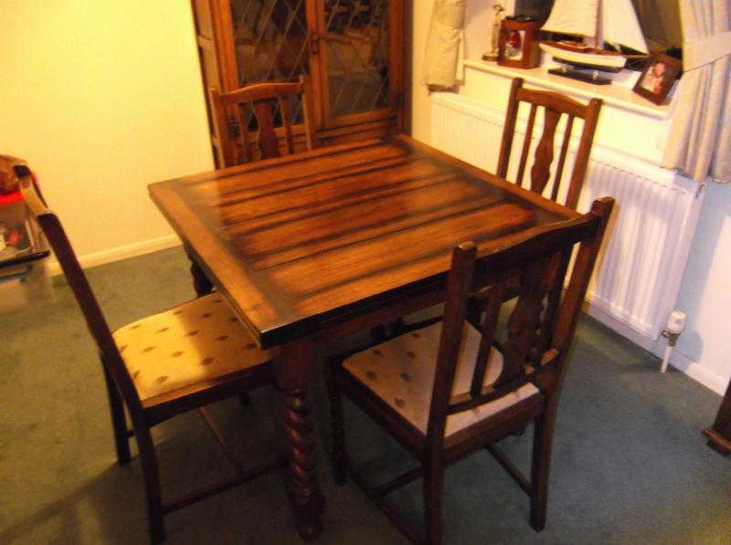 1940s solid oak extending table and 4 padded chairs