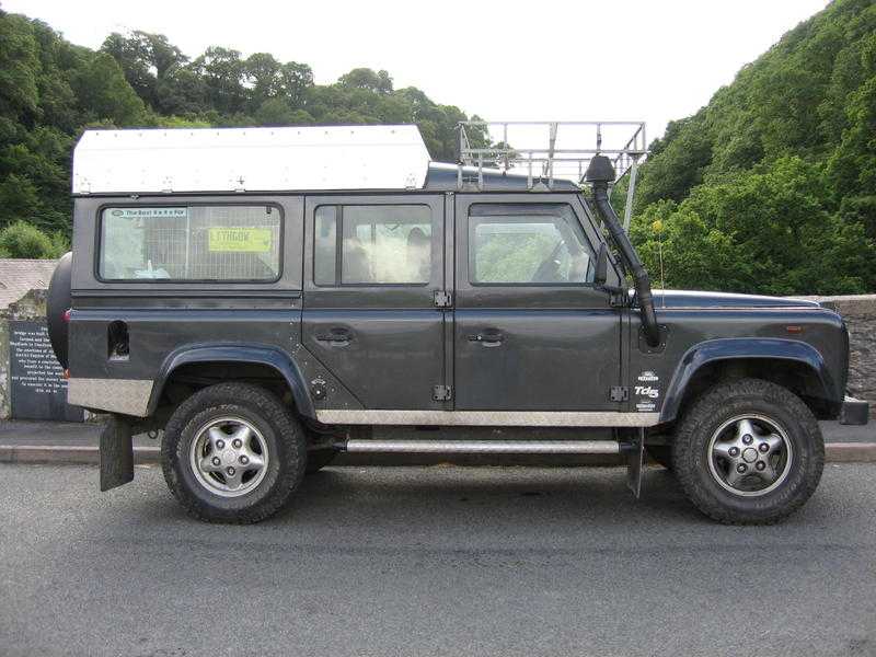 1999 Land Rover Defender 110 county station wagon with roof tent