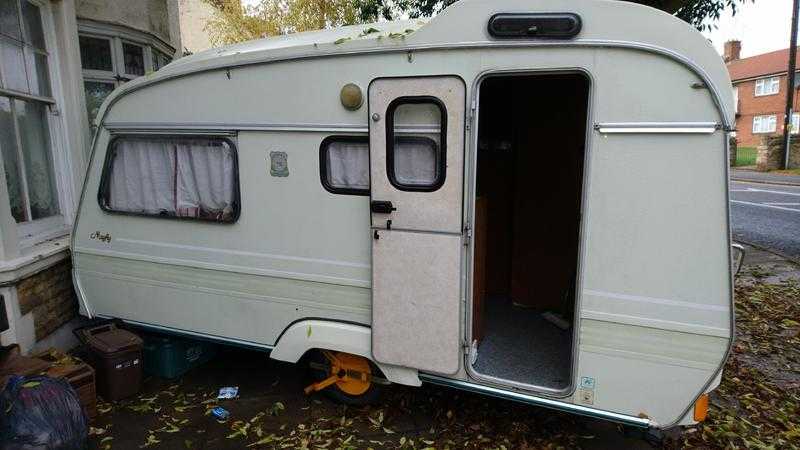 2 berth caravan with awning and wheel clamp