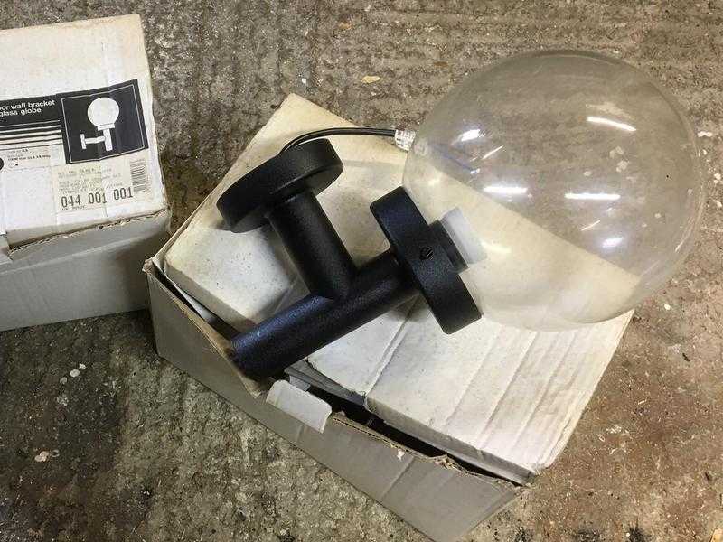 2 black outdoor light wall brackets with globes. 20.  Identical 039new old stock039, with bulbs