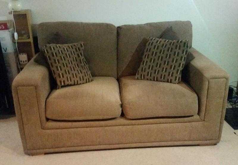 2 brown sofas - 8 cushions - great condition - ready to go