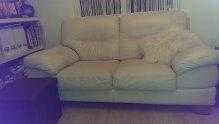 2 cream leather 2-seater sofas