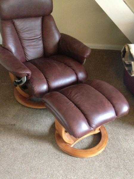 2 identical chestnut leather recliners each with foot stool