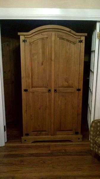 2 identical distressed wax pine wardrobes