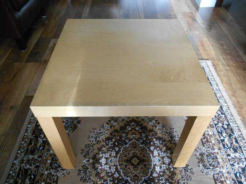 2 light beech end tables in good condition.