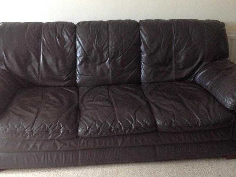 2 matching brown leather sofas