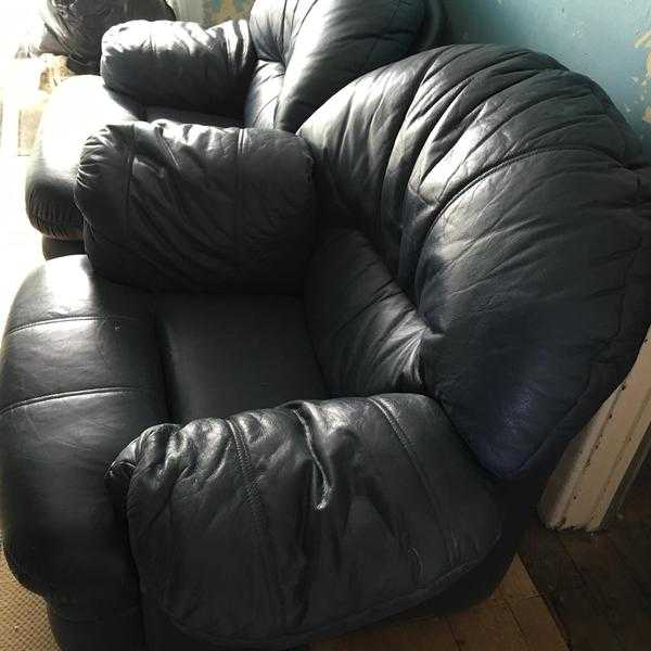 2 Navy Leather Armchairs-one is a Recliner