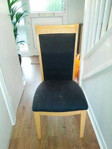 2 pine chairs with black fabric seats