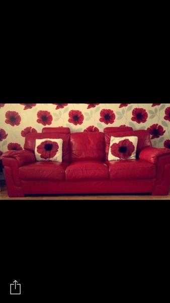 2 red leather sofas