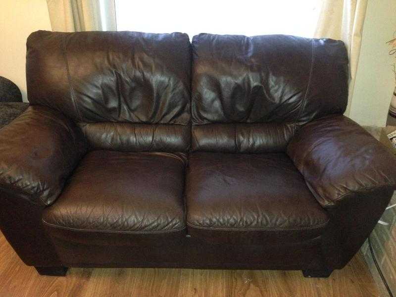 2 seater leather sofa and an arm chair in brown colour