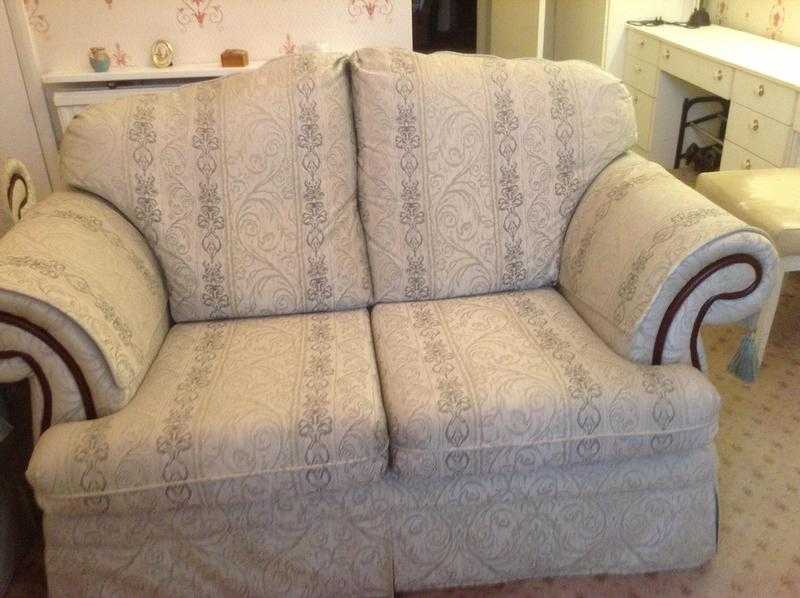 2 two seater sofa in cream and green