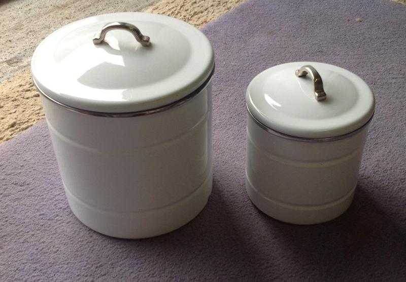 2 white enamel storage tins used