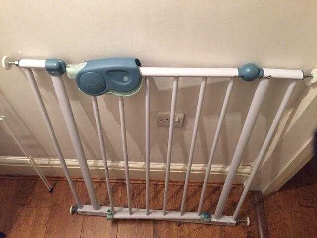 2 white extendable baby gates