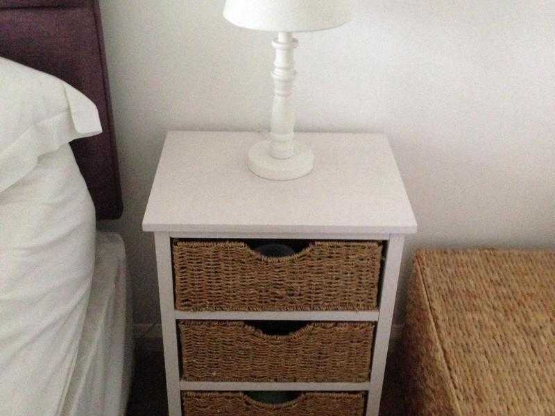 2 white wood and wicker bedside tables