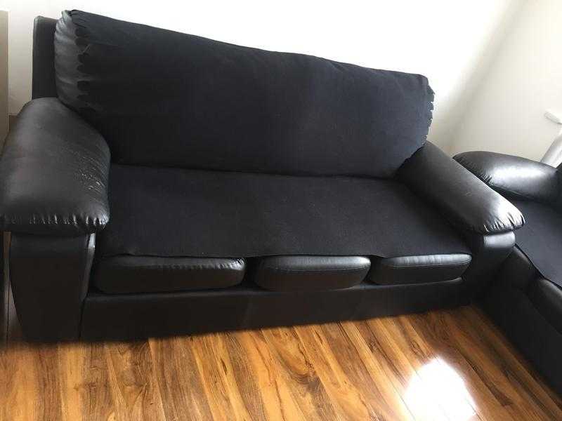 2 X 3 Seater black faux leather sofas