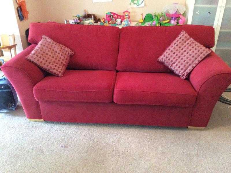 2 X 3 seater dark red sofa with matching cushions and a footstall