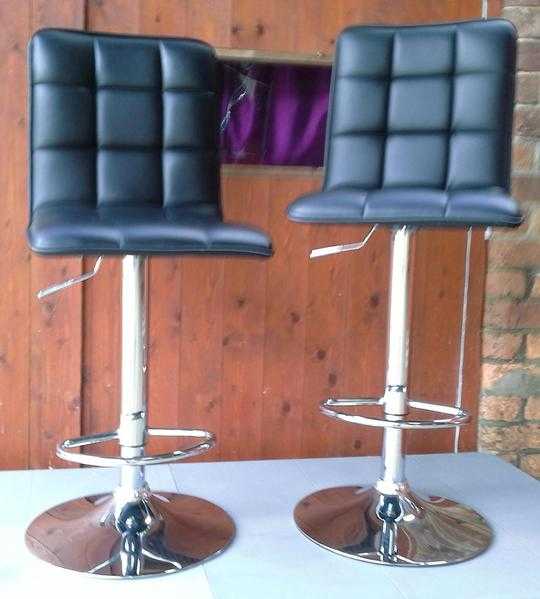 2 x adjustable bar stools.