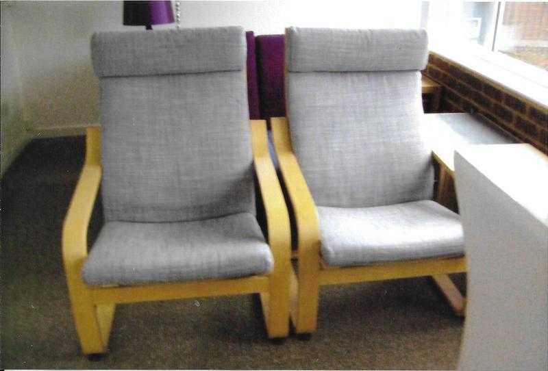 2 X modern light wood armchairs.