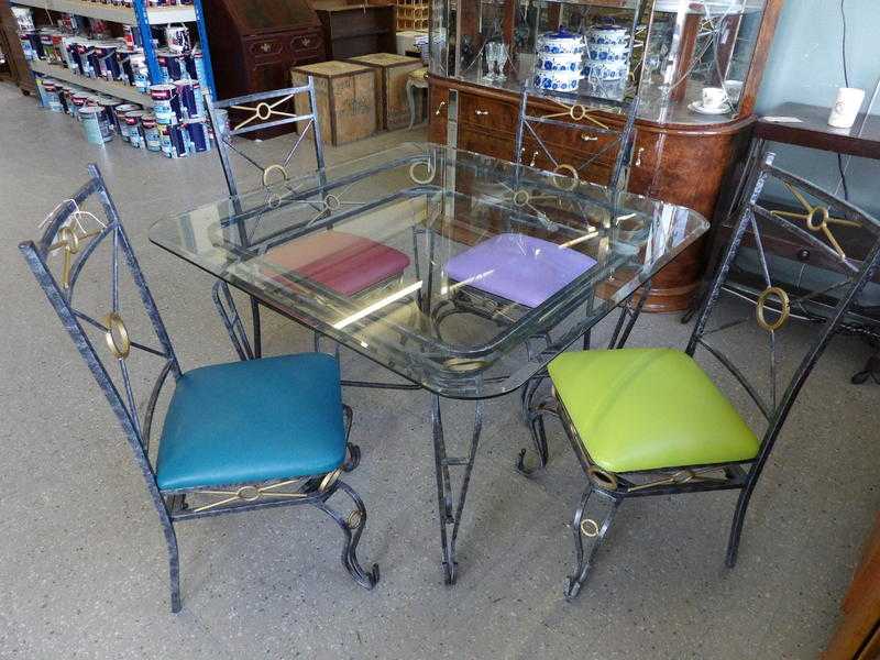 20 off Glass table with 4 chairs reupholstered in a vinyl fabric