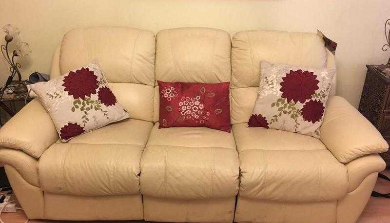 3 piece beige coloured Leather sofa set with reclining foot rest feature.