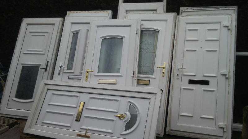 3 upvc doors includes 1 brown and 2 spares