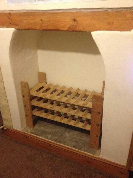 30 Bottle (40-45 if you store underneath the rack)   Solid Wood Large Wine Rack Ideal for Fireplace