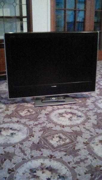 32quot flat screen Toshiba TV attached stand.