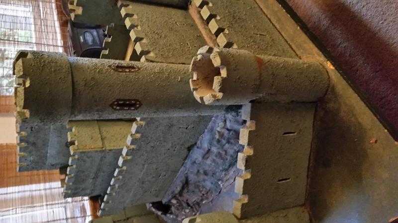 3ft by 3ft hand made toy castle 11 turrets drawbridge and moat. use your imagination .