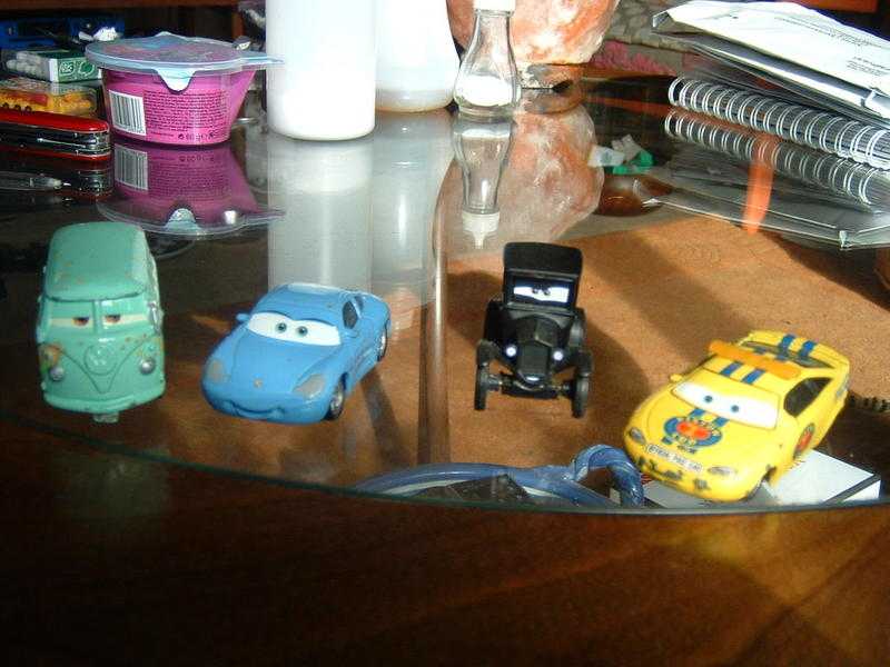 4 small car toys, good condition