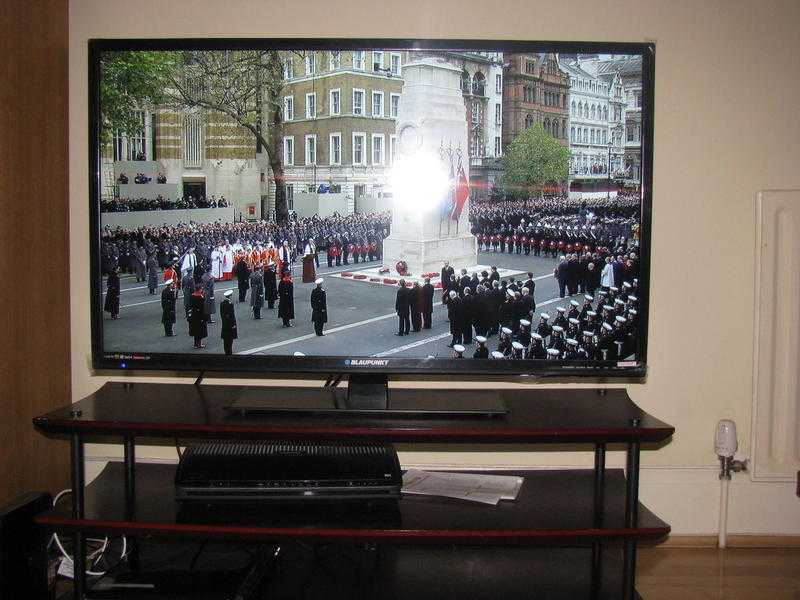 40 inch Blaupunkt full HD LED TV with 3 tier mahogany table only 11 months old