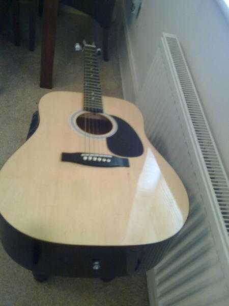 6 String acoustic guitar in near new condition.  Squier, by Fender.  Almost NEW see pics