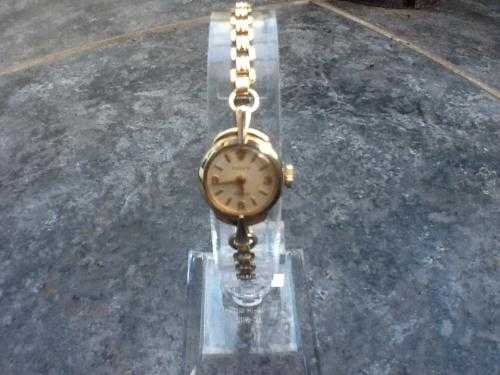 9 ct yellow gold Rolex ladies wrist watch on a rolled gold montal braclet