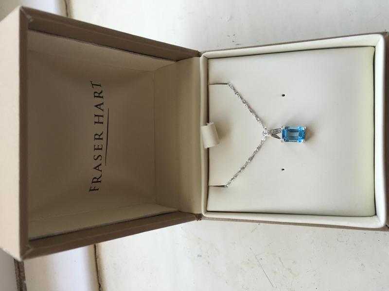 9ct white gold, blue topaz and diamond set pendant and chain