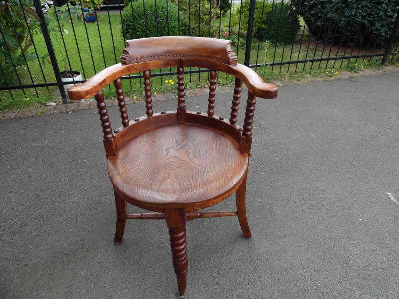 A 19th Century Elm Tub back chair