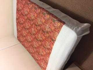 A double bed in very good condition and a soothing floral design.