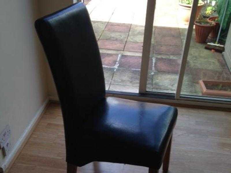 A pair of brown dinning room chairs for sale