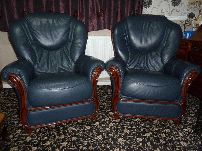 A Pair of Leather Arm Chairs