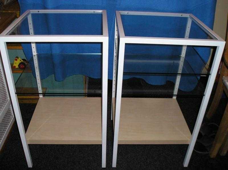 A pair of white shelving units