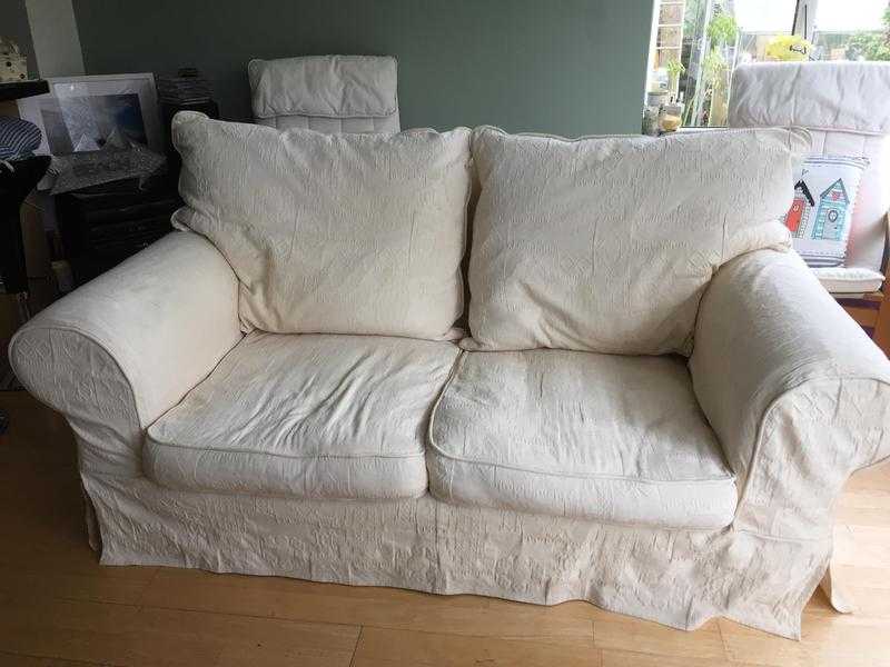 a two seater settee in cream