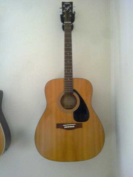 A used and seasoned Guitar A Yamaha f 310. Plays and sounds great-Looks Great.