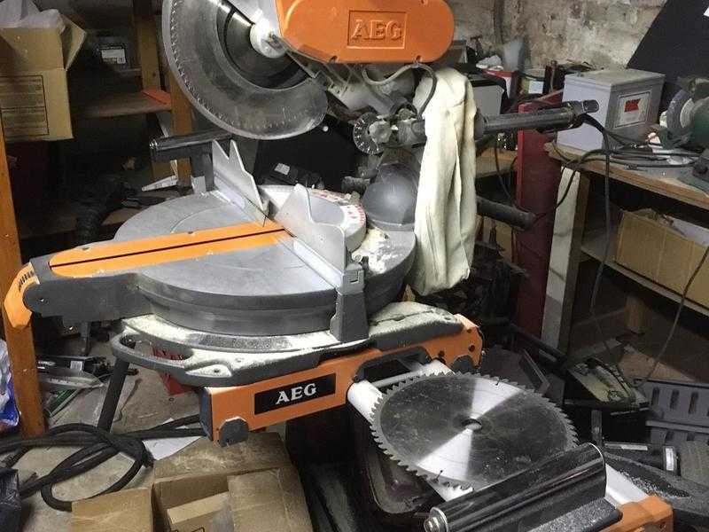 AEG PS 305 DG Compound Sliding Mitre Saw with stand, rollers and spare blade