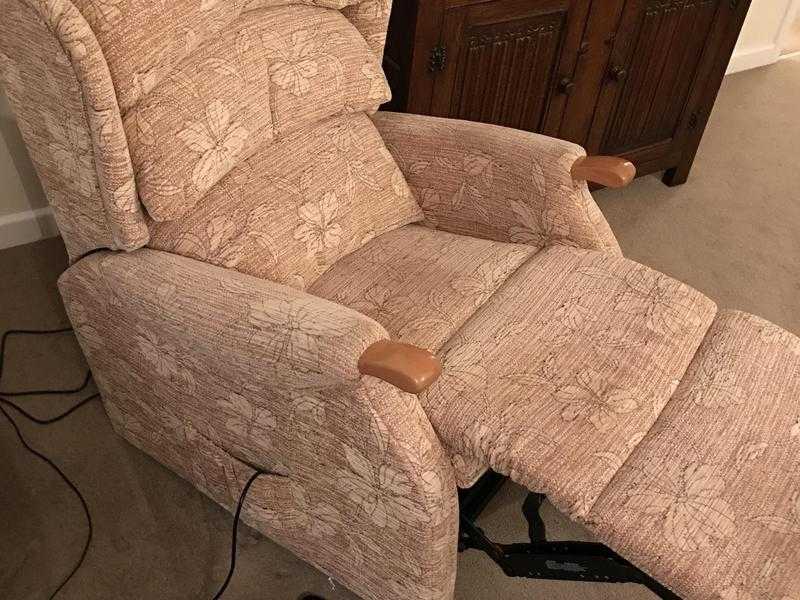 An electric recliner arm chair and matching two seater sofa in immaculate condition