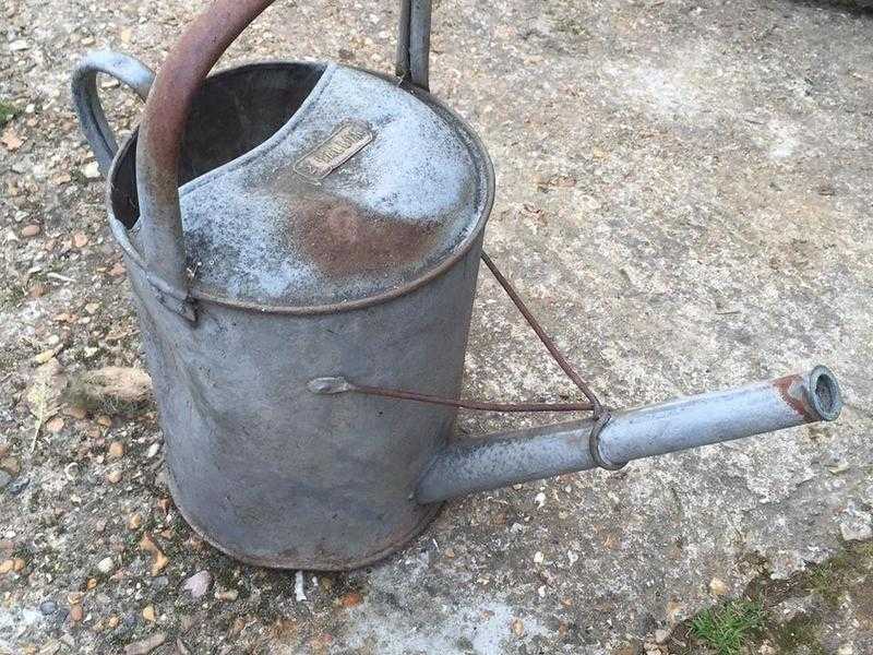 Antique metal watering can