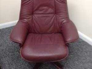 Arm chair and matching foot stool, cream velour