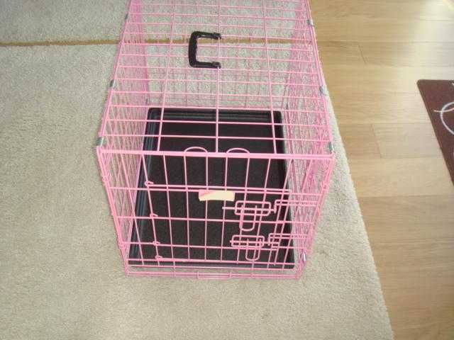 As new pink dogcat travelling cage, folds flat in seconds