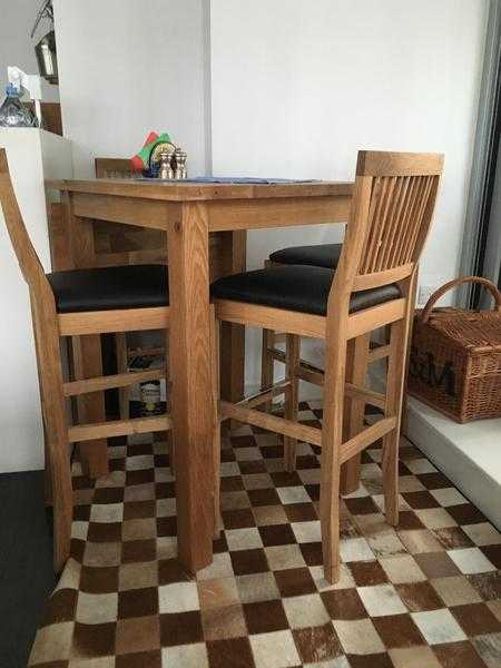 bar table with four bar chairs