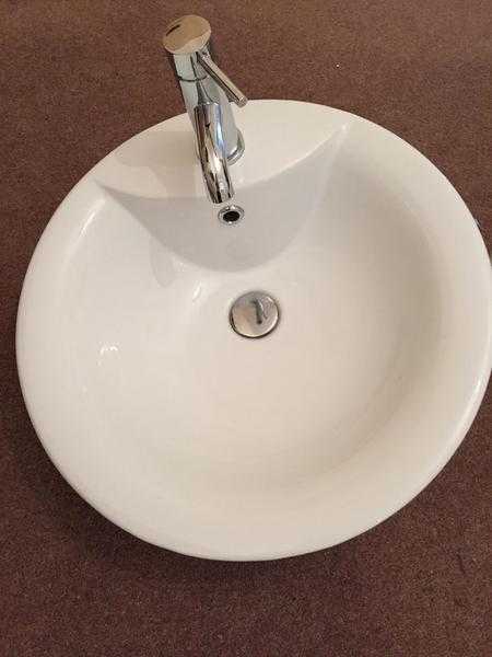 Bathroom sink and taps