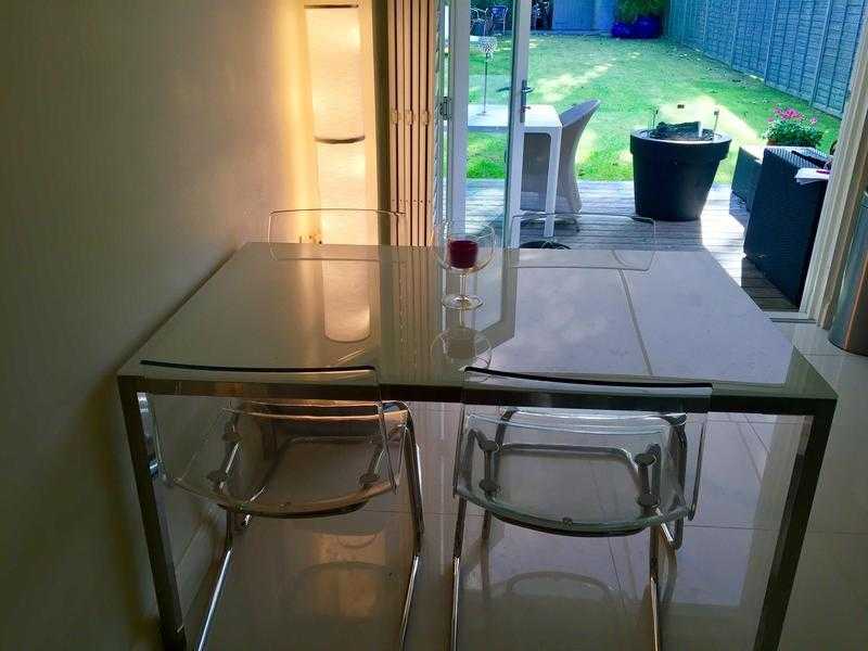 Beautiful Glass and Chrome Dining Table, plus 4 Clear Perspex and Chrome Chairs